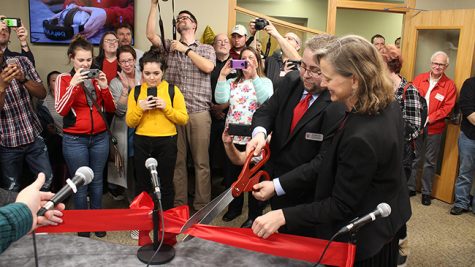 Students and faculty watch as Assistant Professor of Journalism and Media Adam Maksl and School of Social Sciences Dean Kelly Ryan cut the ceremonial ribbon to officially launch Horizon Radio.