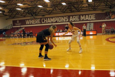 Junior Madi Woods guards against a Carlow point guard in the first half of their 77-67 win over the Celtics.