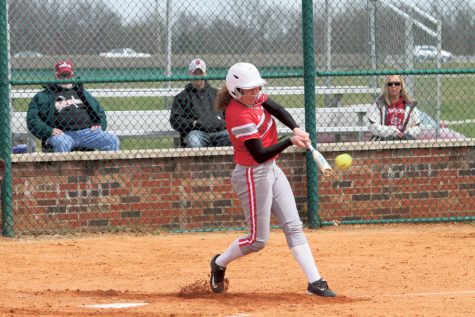 Senior pitcher Becca Schoenung hits a fastball to avoid a strike. Photo courtesy of IUS Athletics, used with permission.