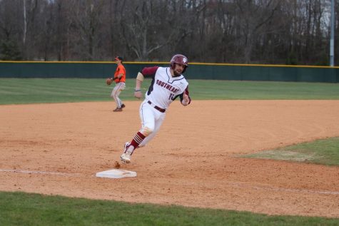 Danny Brescia rounds third in the Grenadiers matchup with Bryan University. Photo courtesy of the IUS Athletics Department.