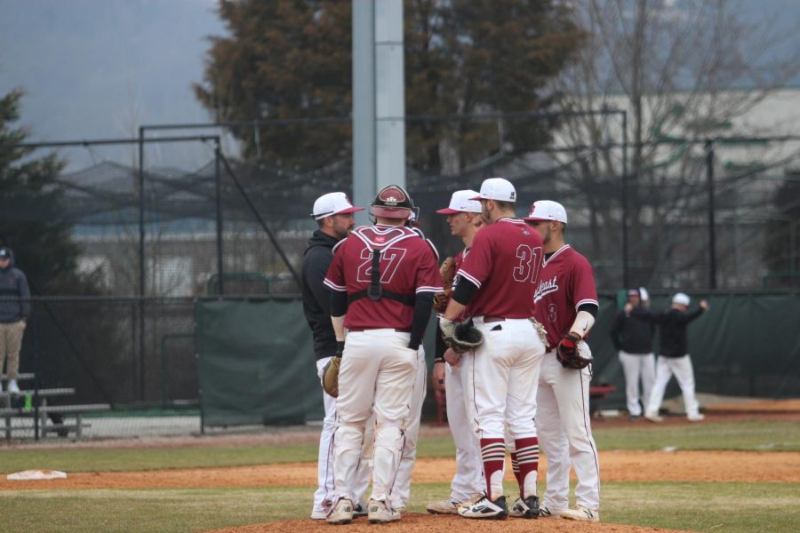 Head Coach Ben Reel and the IUS baseball infield gather around relief pitcher Owen Evans during game one of last Saturdays doubleheader against Rio Grande.