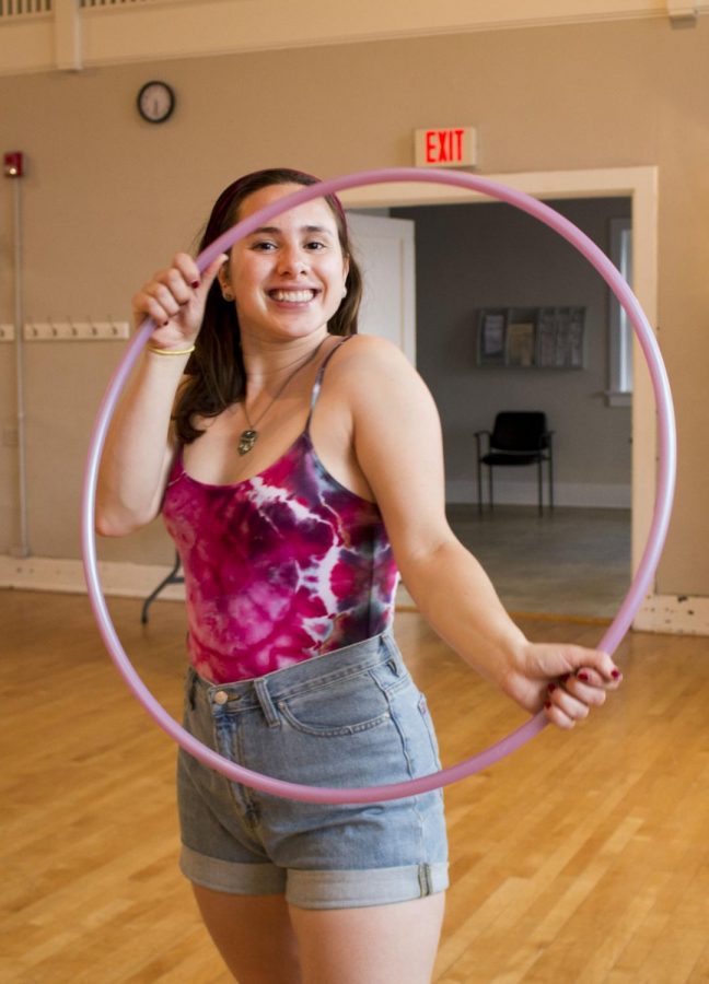 With hula hoop in hand, Andrea Sphilberg enters the doors of Unity of Louisville for a Thursday evening flow jam. 
