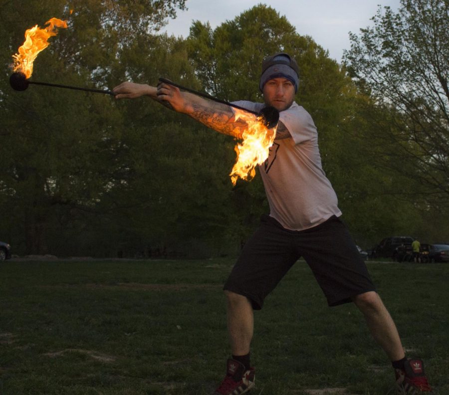 Benjamin Lacy (Benjamin Dragon) spins fire poi at Cherokee Park during a Tuesday evening flow jam. 