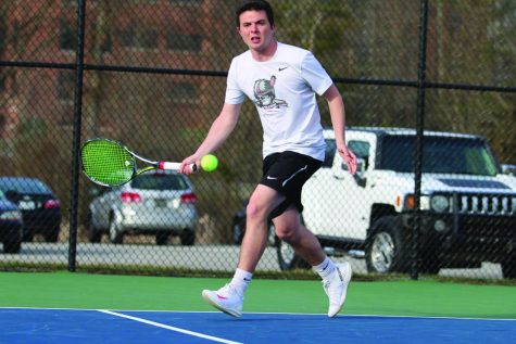 Daulton Fensler hustles to answer a serve sent down the line. Fensler hopes to travel far with the men’s squad this postseason.