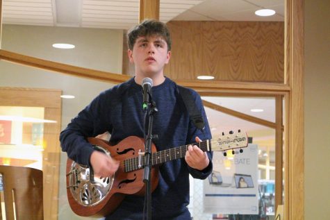 Jacob Howard, a freshman who is an English Education Major, sings “Michael” by Red House Painters while playing his guitar. “My parents started getting me guitar lessons and I hated it but once I started listening to music, I was like, ‘oh, this might be worthwhile.’ I like performing...and I love that song too.”