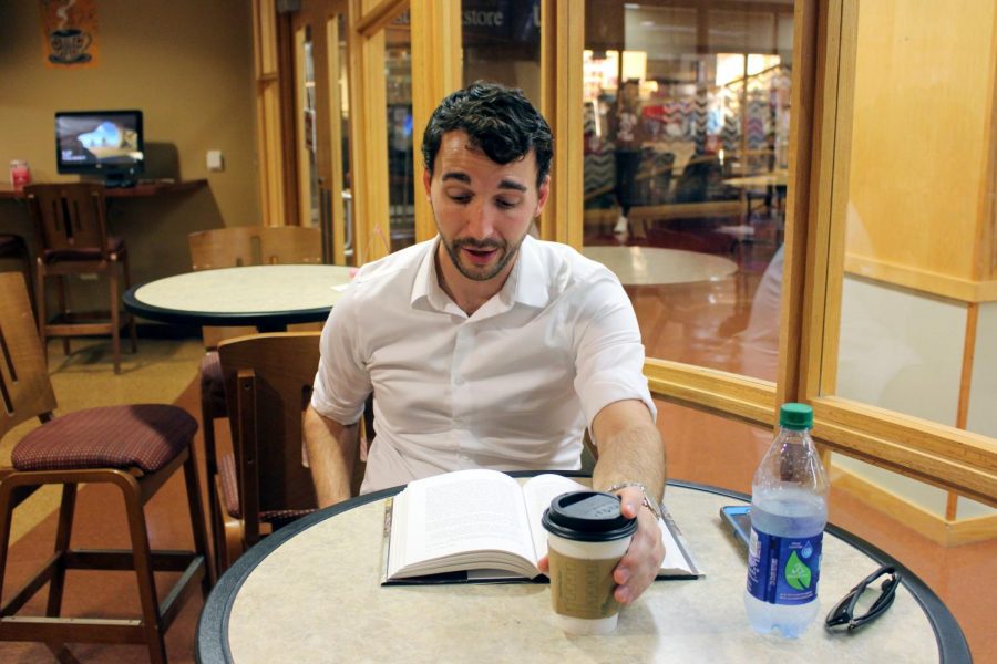 Matthew Goldberg, adjunct history professor at IU Southeast, sits in the University Grounds Coffee Shop, enjoying a cup of coffee and a book as he takes a moment to relax from his hectic schedule.