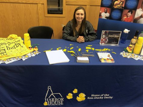 Robin Pitmann, communications and outreach coordinator for Harbor House of Louisville, sits at her organizations table at the annual IUS Volunteer Fair.
