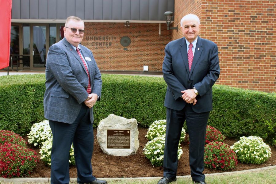 IUS Chancellor Ray Wallace (left) and IU President Michael McRobbie (right) pose in front of Lyda Radfords historical marker.