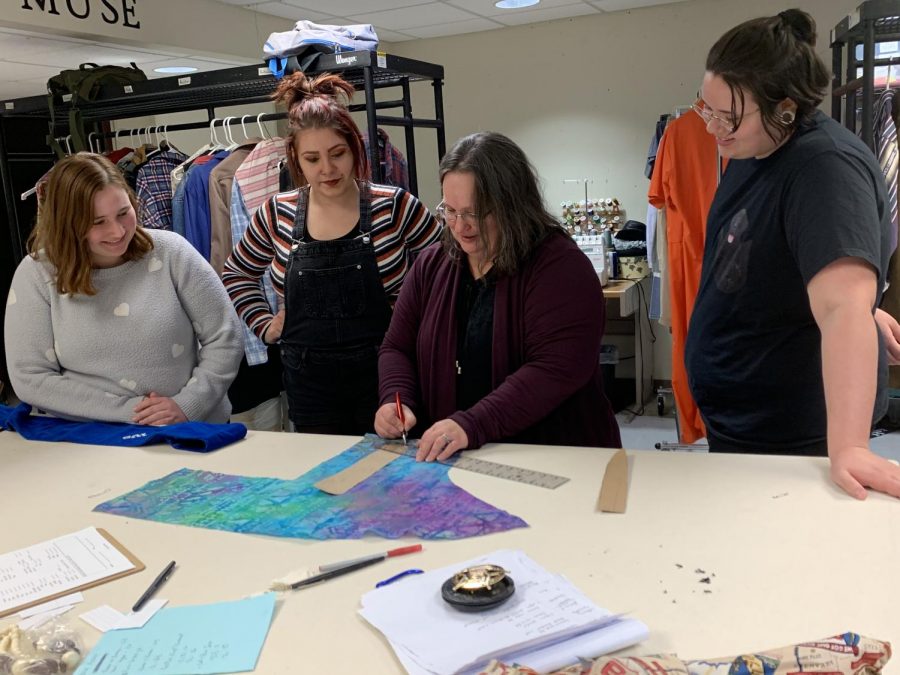 Natalie Bowman gives assistance to her wardrobe crew as they design a new costume. (left to right: Alyssa Fry, Erin Hogle, Natalie Bowman, Alex Conn).