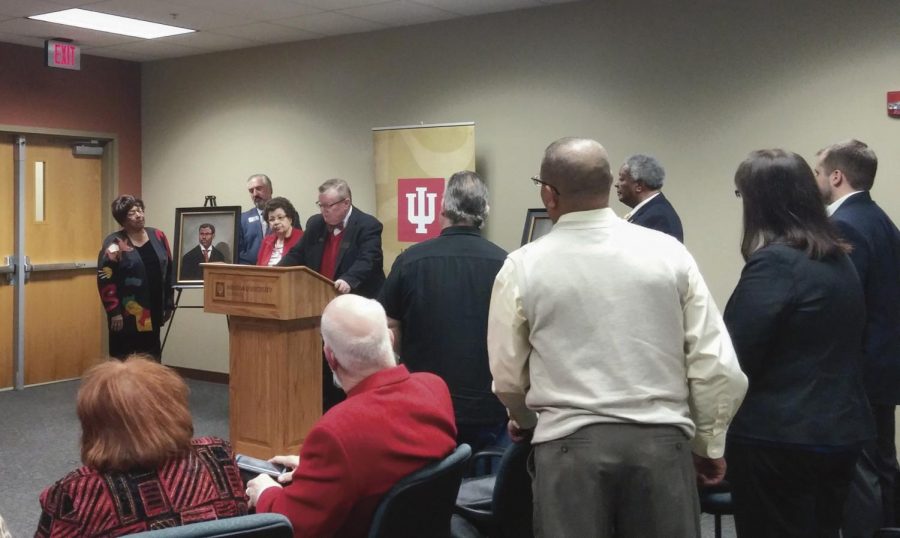 IU Southeast Chancellor Wallace speaks behind a lecturn during the Neal-Marshall Portrait Dedication.