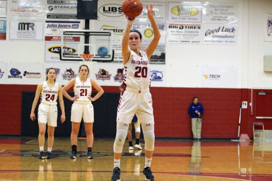 Senior Guard Madi Woods surpasses 1,000 career points with a free throw during the fourth quarter of the Grenadiers win against Midway.