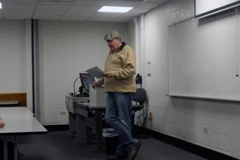 Roger Baylor reads an excerpt from a poem during his “The History of Beer in New Albany” presentation at IU Southeast. 