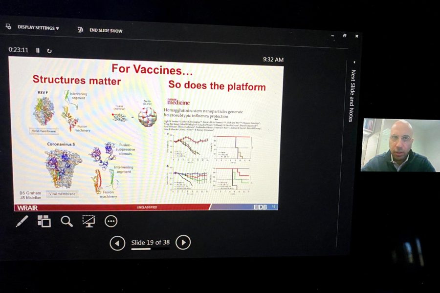Dr. Kayvon Modjarrad shows a slideshow about his institutions COVID-19 vaccine. He discusses that the structure and the platform of the virus matters the most when creating the vaccine.