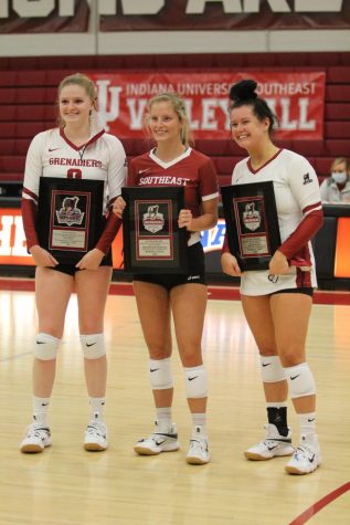 From left to right,IU Southeast Volleyball seniors Alexis Bassett, Kenna Burman, and Hannah Sipe pose with commemorative plaques during senior night festivities prior to the Grenadiers' home match against Asbury University.