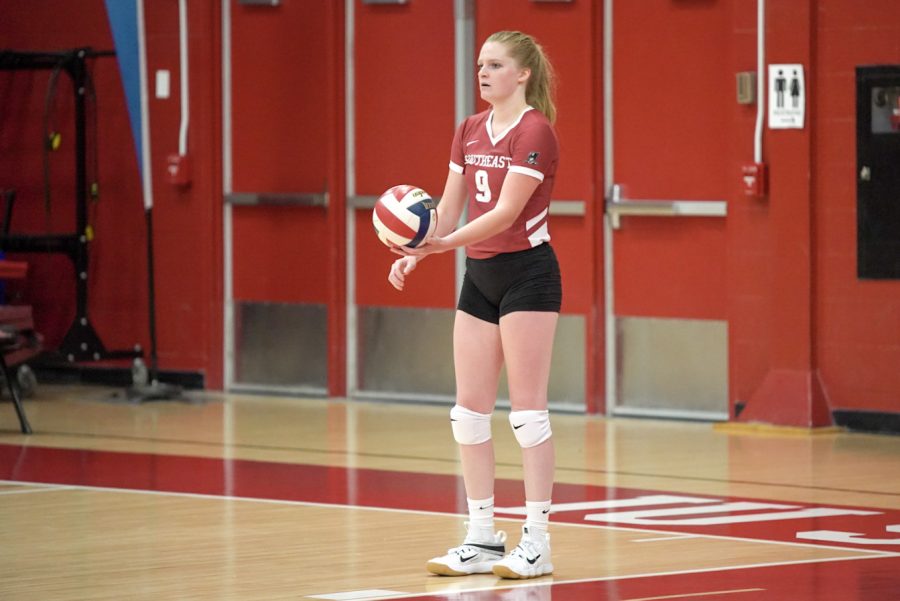 Senior Alexis Bassett prepares to serve during the IUS Volleyball team's season opener against Oakland City University.