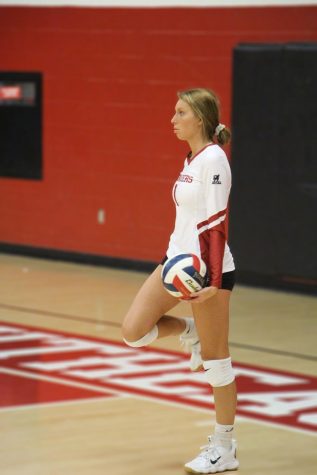 Freshman Brandy Eisenback waits for the signal to serve during the Grenadiers' volleyball match against IU Kokomo.