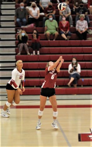 Senior Libero Kenna Burman (Center) sets for Outside Hitter Delaney Nichols during a home match against Asbury on Sept. 25, 2020.