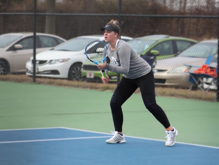 Freshman Audrey De Witt prepares to receive a service from Georgetowns Maci Ferguson during the Grenadiers home match against the Tigers on Feb. 27. De Witt fell behind in #1 singles before rallying back to win 3-6, 6-3, 10-5.