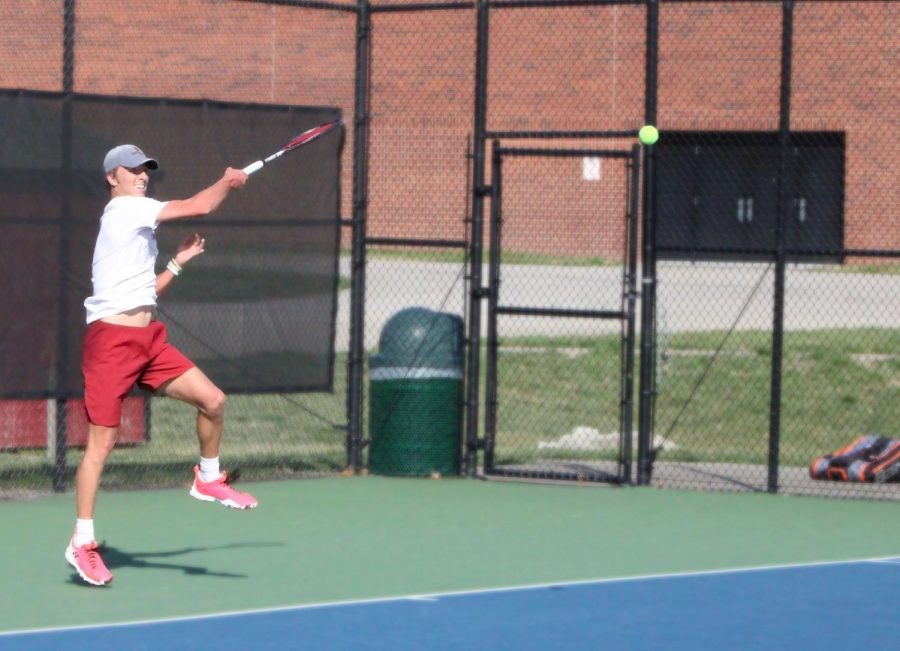 Freshman Connor Mason returns a volley against Asburys Duarte Teixeira at #5 singles on March 27. Mason fell behind early in the match before rallying back to win the match 4-6, 6-3, 1-0(8).