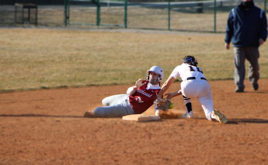 Ellie Jackman barely beats the tag of Siena Heights Lily Guerra to steal second base during game two of a doubleheader against the Saints on March 6.