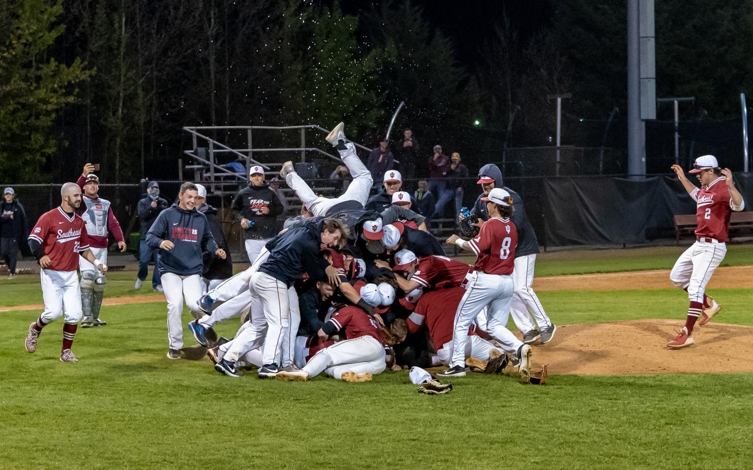 The IU Southeast Baseball team dogpiles in front of the pitchers mound after sophomore right-hander Drew Hensley finishes off a complete-game against Midway on April 23. The 6-2 victory, which came in the nightcap of a doubleheader, clinched the Grenadiers third consecutive RSC Regular-Season title and their fifth-straight trip to the NAIA Opening Round.
