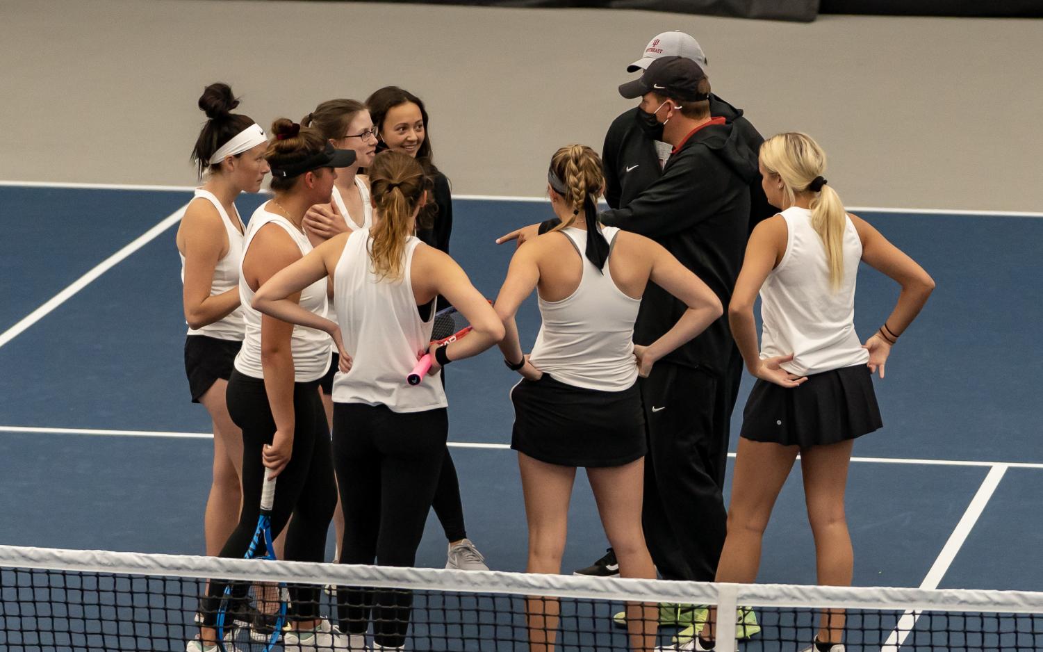 Head coach Joe Epkey gives his Grenadier womens tennis squad a pep talk prior to the singles portion of their RSC Semifinal matchup against IU East on April 23.