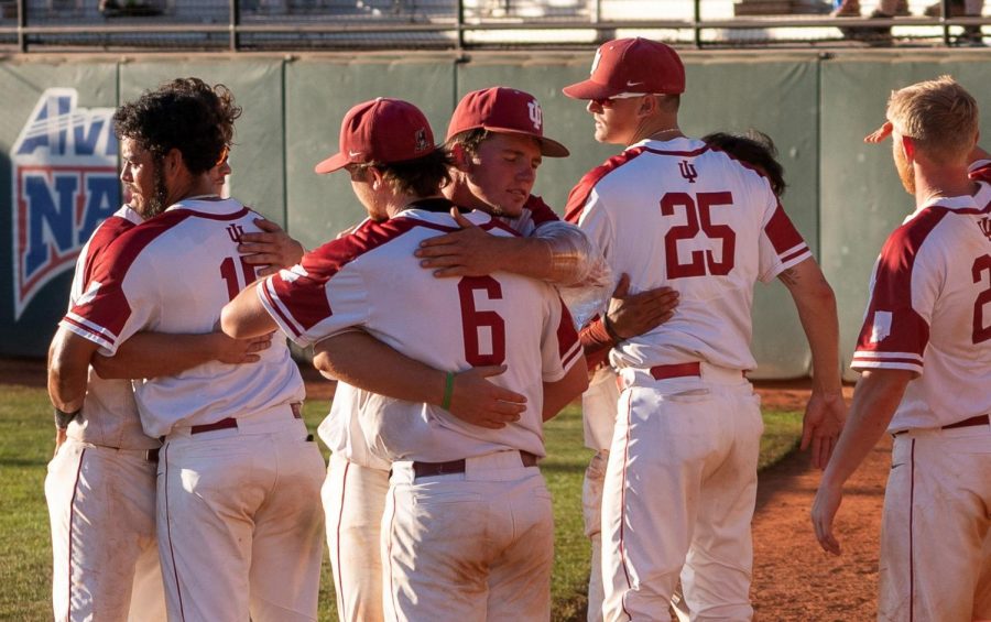 Members of the IU Southeast Baseball team embrace in hugs following their season-ending loss to #11 Faulkner in the NAIA World Series. The #15 Grenadiers finished the 2021 campaign at 50-16 and went 2-2 in their first ever trip to the World Series.