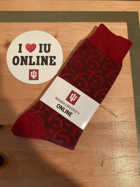 A fridge magnet and a pair of socks sent as a ‘swag’ giftbox to Kripa Collins from Indiana University Southeast.